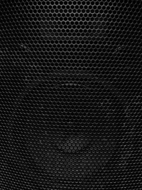 istock Black metal speaker mesh background, Metallic texture or pattern with small holes, monochrome image 1331891197