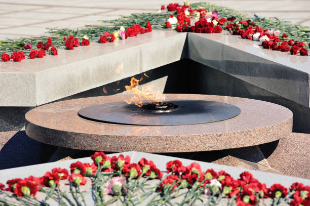 istock eternal flame and flowers on the monument 1331891350