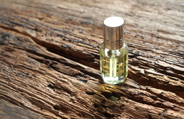 istock Elegant perfume bottle on a wooden background 1331891683
