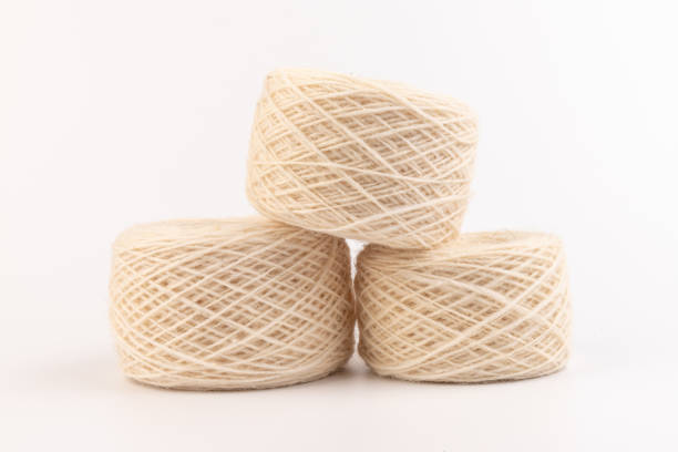 istock balls of light woolen thread on white background. natural wool. knitting. background 1331902275