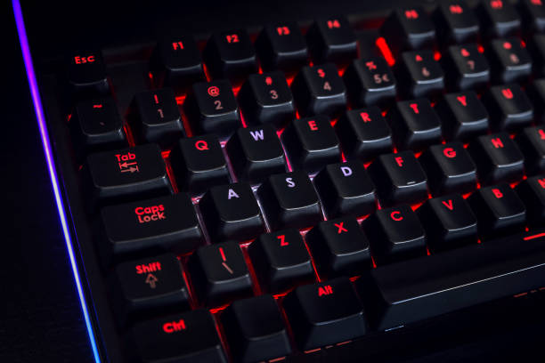 istock Red backlit gaming keyboard with highlighted movement keys 1331902594