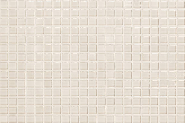 istock Cream pastel ceramic wall and floor tiles abstract background. Design geometric mosaic texture decoration of the bedroom. Simple seamless pattern for backdrop advertising banner poster or web. 1331903906
