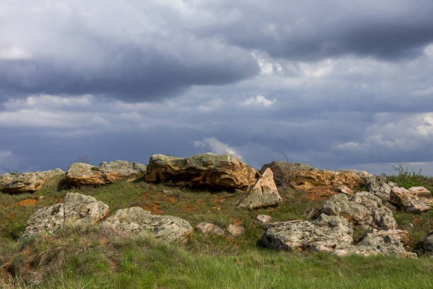 istock Bizarre boulders against the backdrop of heavy clouds 1331906347