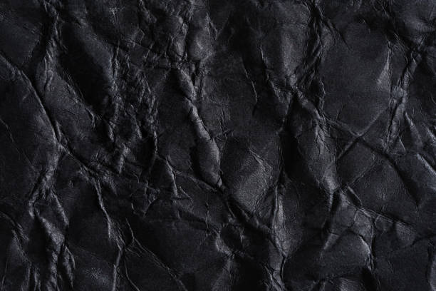 istock Paper black wrinkled background. 1331909263