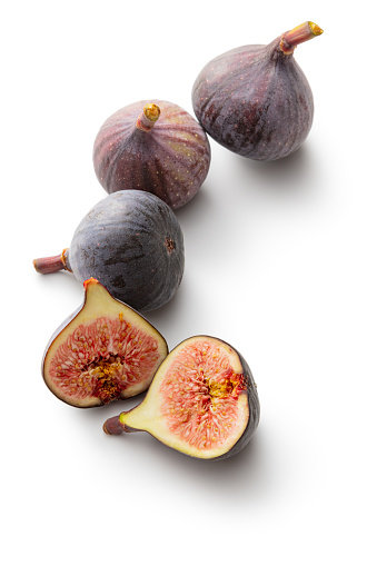 purple figs in front of white background