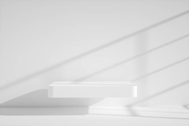istock 3D background, white pedestal podium on natural white backdrop. window shadows on the wall, Clean minimalist empty template with mockup. Square levitating shelf. 1331909537