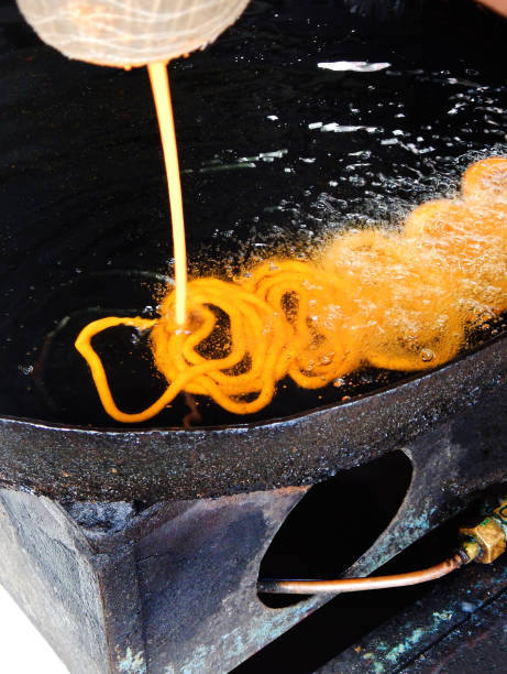 view of making Indian street food Jalebi, a popular sweet stock photo