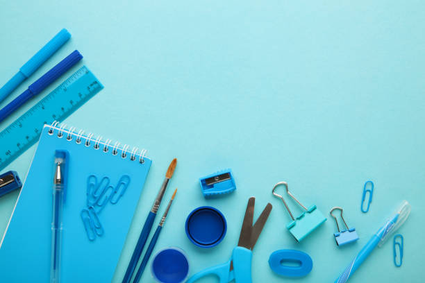 istock Blue school supplies on blue background. Back to school. Flat lay. 1331919778