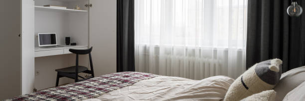 istock Stylish bedroom with desk, panorama 1331920645