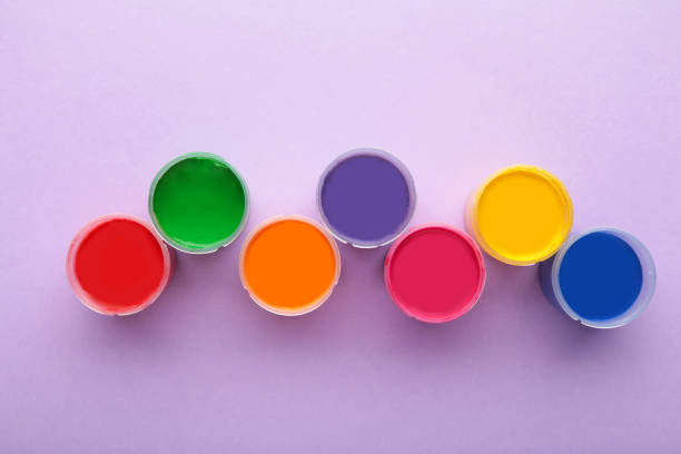 istock Multicolored gouache on a purple background with copy space. 1331920773