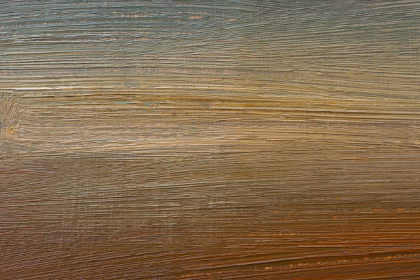 Abstract multicolored background with oil paint. Hand-textured background for signage and banners. A mix of brown, red, sand-beige, yellow and chocolate colors on canvas. Colorful artistic background.