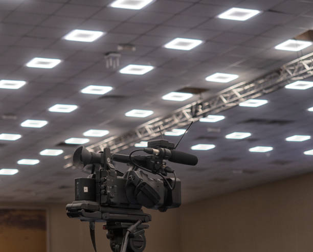 istock TV camera in the press conference room. 1331922577