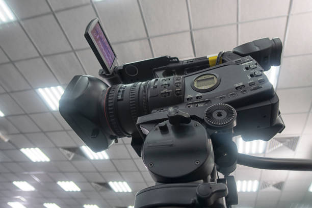 istock TV camera in the press conference room. 1331922646