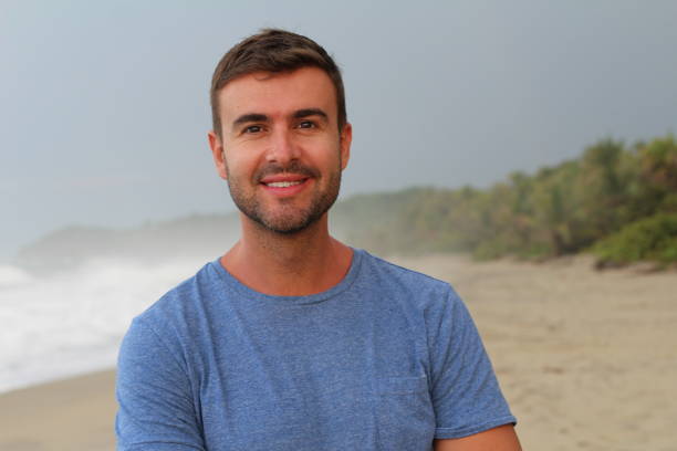 istock Healthy guy smiling at the beach 1331923817