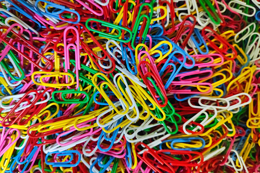 Colorful stack of paper clips, perfect for good office background