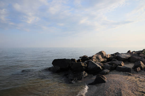 istock Beautiful view sandy sea beach with rocks 1331924328