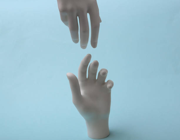 istock The mannequin's white hands touch each other on blue background. Minimalism. Concept art 1331924552