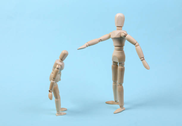 istock Angry parent puppet points with hand and scolds the child. Negative emotion, teenage problem concept. Isolated on blue 1331926592