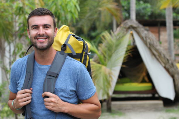 istock Man enjoying ecotourism in tropical camping site 1331926605