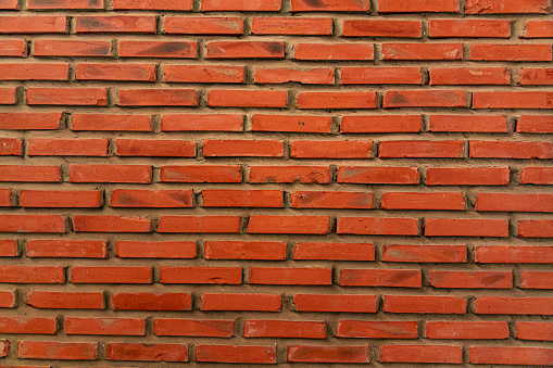 Red brick wall seamless. Red brick wall background texture close up. Great for a background or wallpaper.