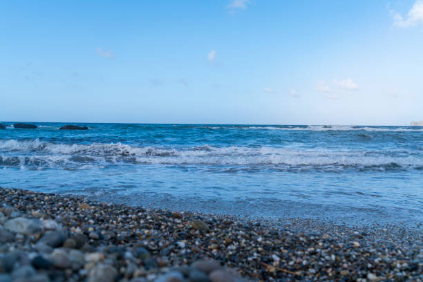 istock waves on the sea and stone beach 1331929816