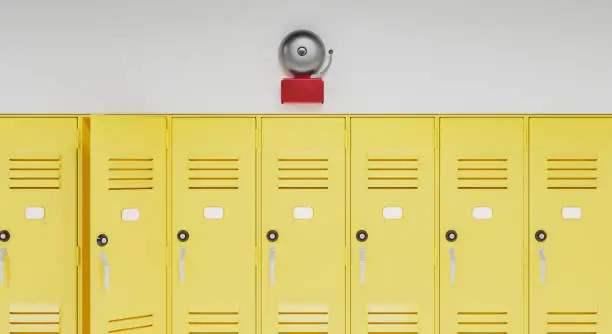 school bell above a row of yellow lockers. concept of education and back to school. 3d render