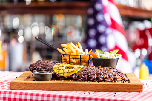 Ribs with salad and french fries served in an american restaurant