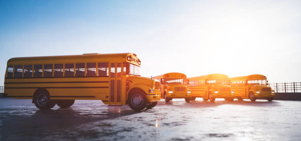 Yellow school bus fleet on parking stock photo