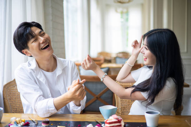 istock Young couple dating and having fun at cafe 1331937566