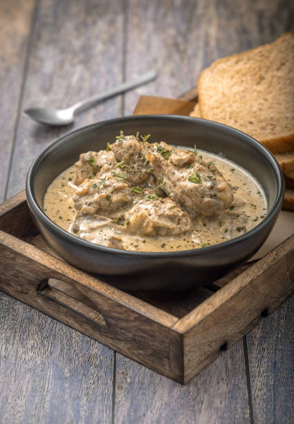 istock cream chicken curry with bread for lunch 1331938827