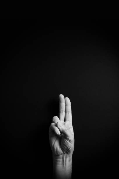 istock B&W image of hand demonstrating ASL sign language letter U with empty copy space 1331940292