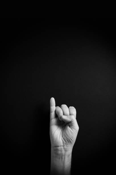 istock B&W image of hand demonstrating ASL sign language letter I with empty copy space 1331940309