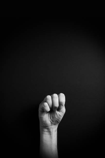 istock B&W image of hand demonstrating ASL sign language letter M with empty copy space 1331940365