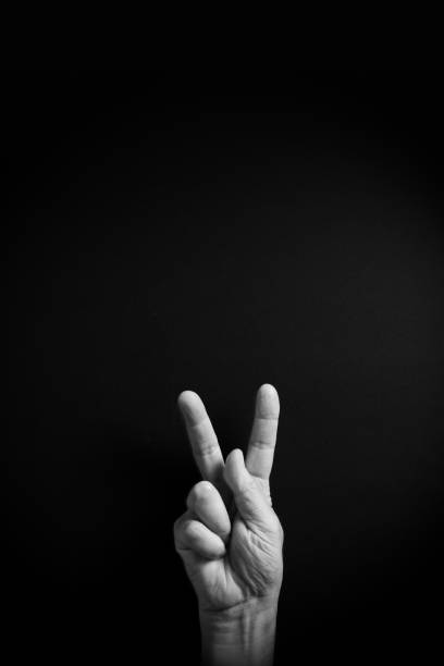 istock B&W image of hand demonstrating ASL sign language letter K with empty copy space 1331940404