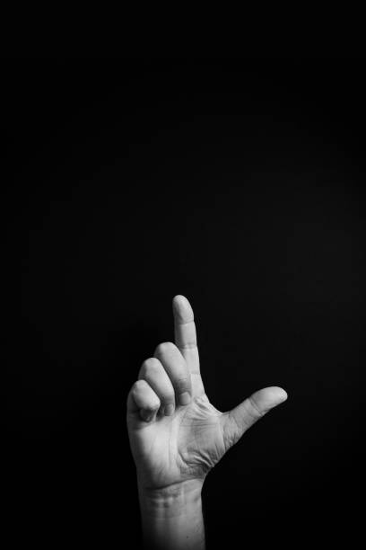 A close-up of a hand making a \
