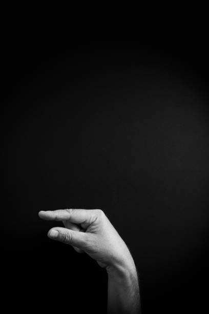 istock B&W image of hand demonstrating ASL sign language letter G with empty copy space 1331940580
