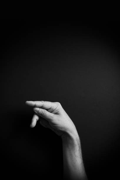istock B&W image of hand demonstrating ASL sign language letter P with empty copy space 1331940596