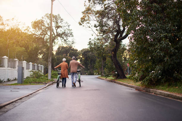 istock Shot of a mature taking a walk with their bikes 1331940659