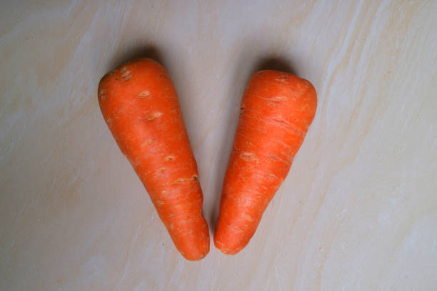 two small carrots ready to cook photo