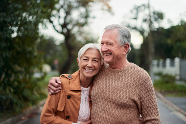 istock Shot of a mature couple taking a sunset stroll 1331941003