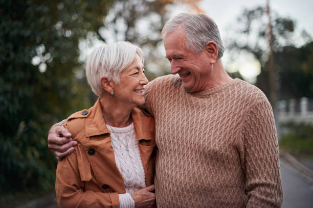 istock Shot of a mature couple taking a sunset stroll 1331941008