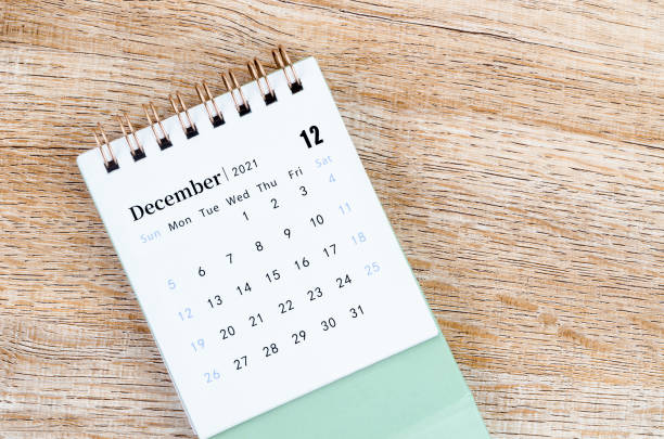 istock December Calendar 2021 on wooden table 1331943444