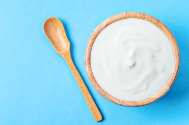 istock Greek yogurt in wooden bowl 1331943471