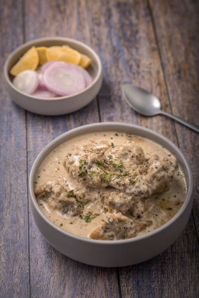 istock cream chicken curry with flatbread chapati or paratha 1331943674