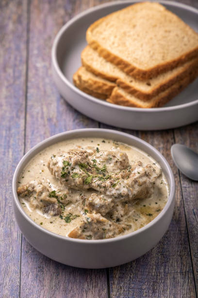 istock cream chicken curry with bread for lunch 1331944679