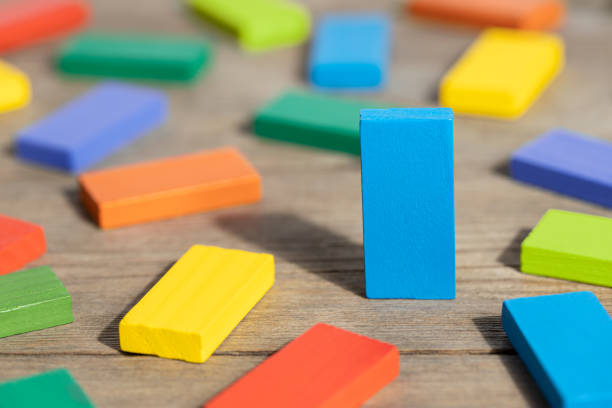 istock Colorful domino on wooden table 1331944999