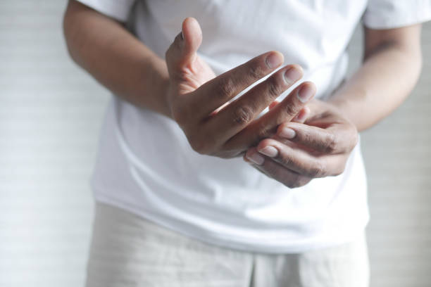 istock man suffering pain in hand close up 1331946282