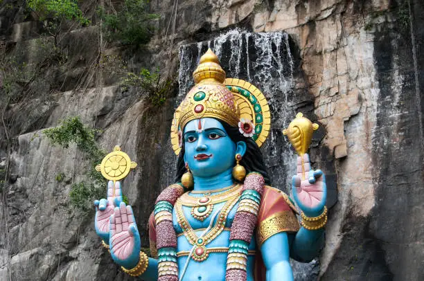 A large statue of lord krishna at the entrance of ramayana cave within the Batu Cave scenic area Gombak, Selangor Malaysia.