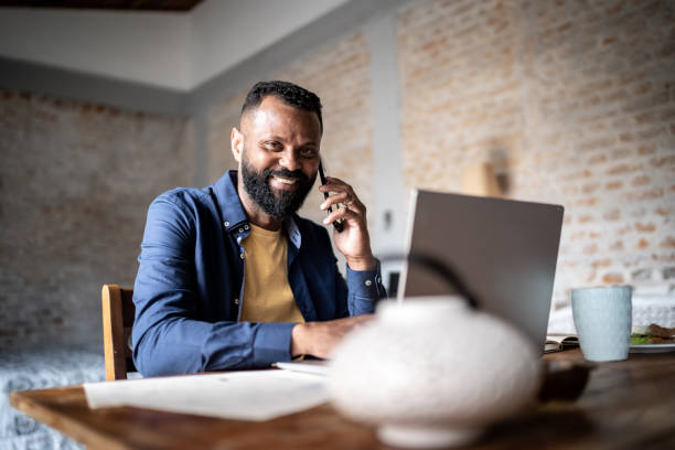 istock Portrait of a mature man using laptop working at home 1331948302