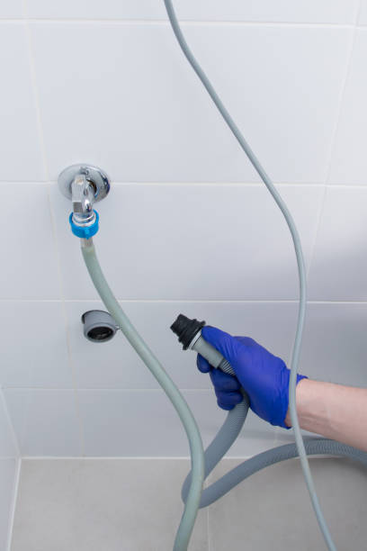 istock installation of a washing machine, connection to water supply and drainage systems 1331948488